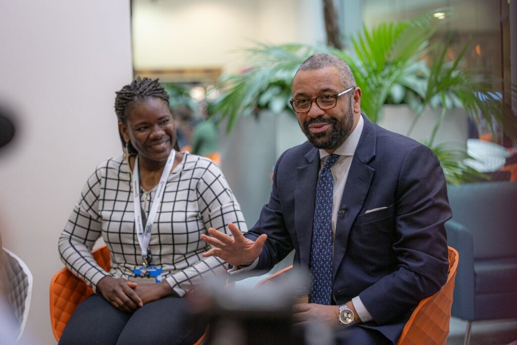 James Cleverly in conversation with a member of the public at a community event in London