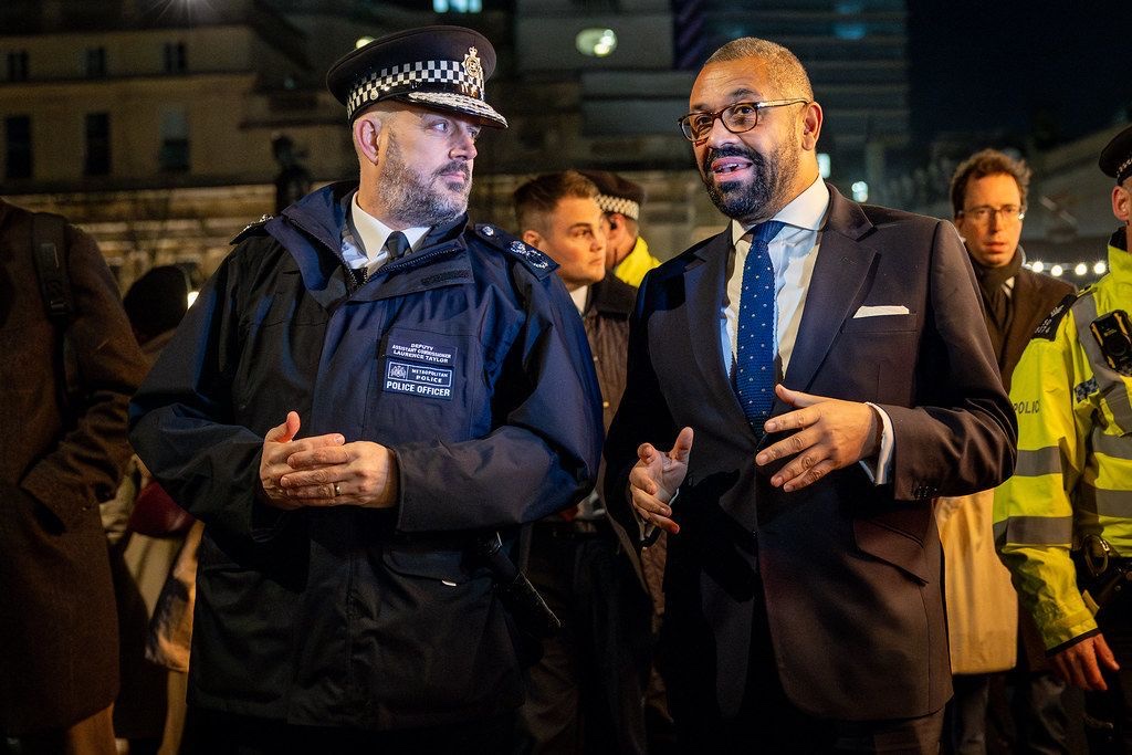 James Cleverly talking with a senior Metropolitan Police officer at a night-time operation